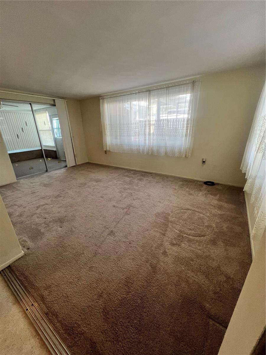Flex room off of kitchen/kitchennette.  There is a pass through window from the kitchen