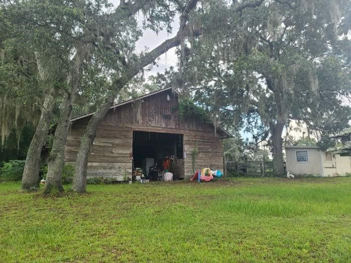 Barn and multiple sheds on property