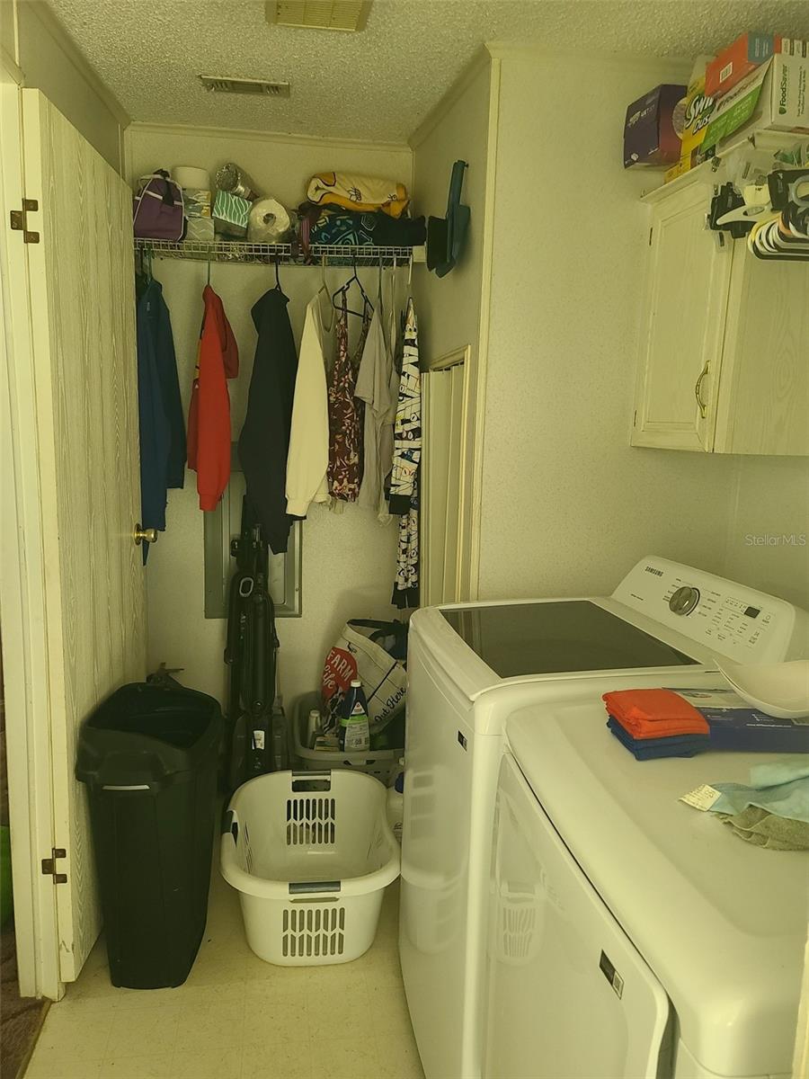 Laundry room off DR with exterior door to car port and back yard.