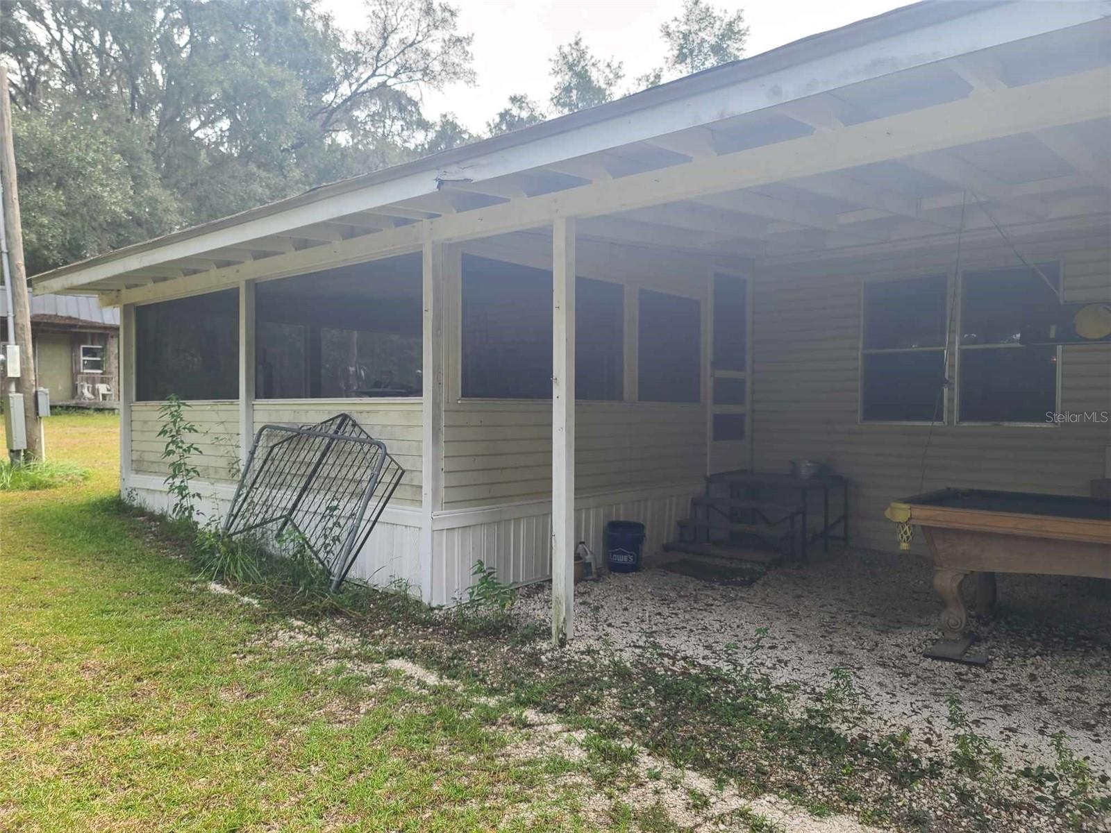 Back Car Port off Laundry Room and Back Porch