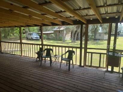 Spacious outdoor living on the screen front porch