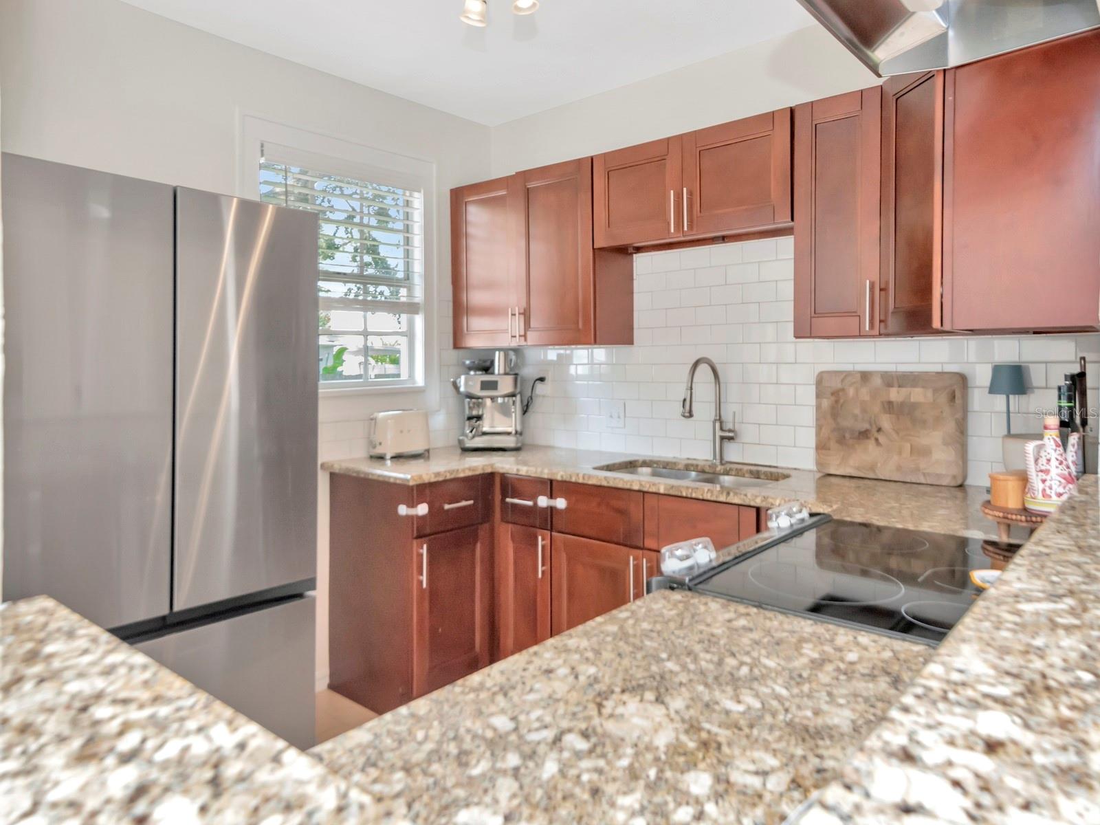 Updated Kitchen with Granite Countertops and Stainless Steel Appliances