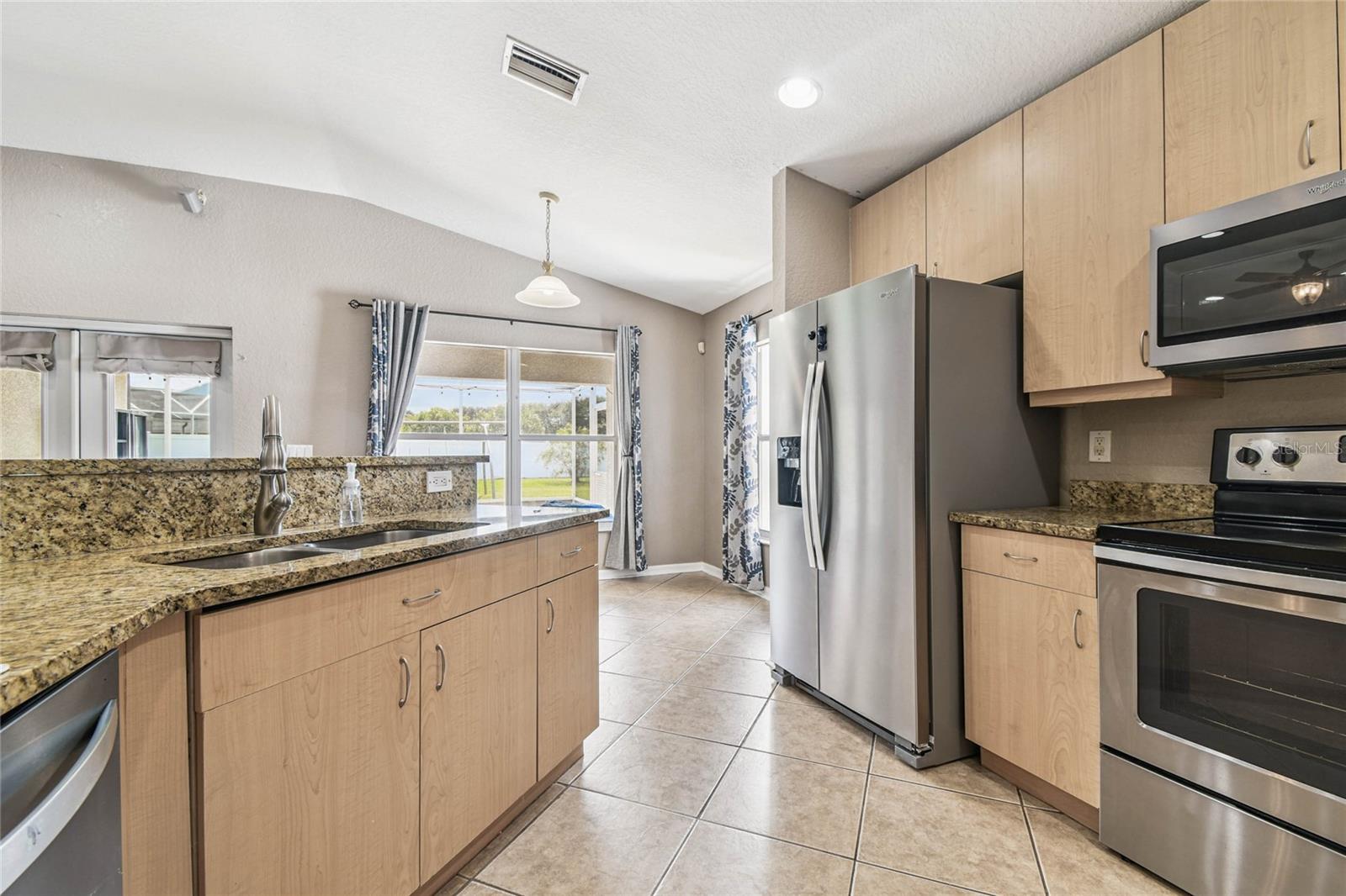 Beautiful granite counter tops really make this kitchen pop.