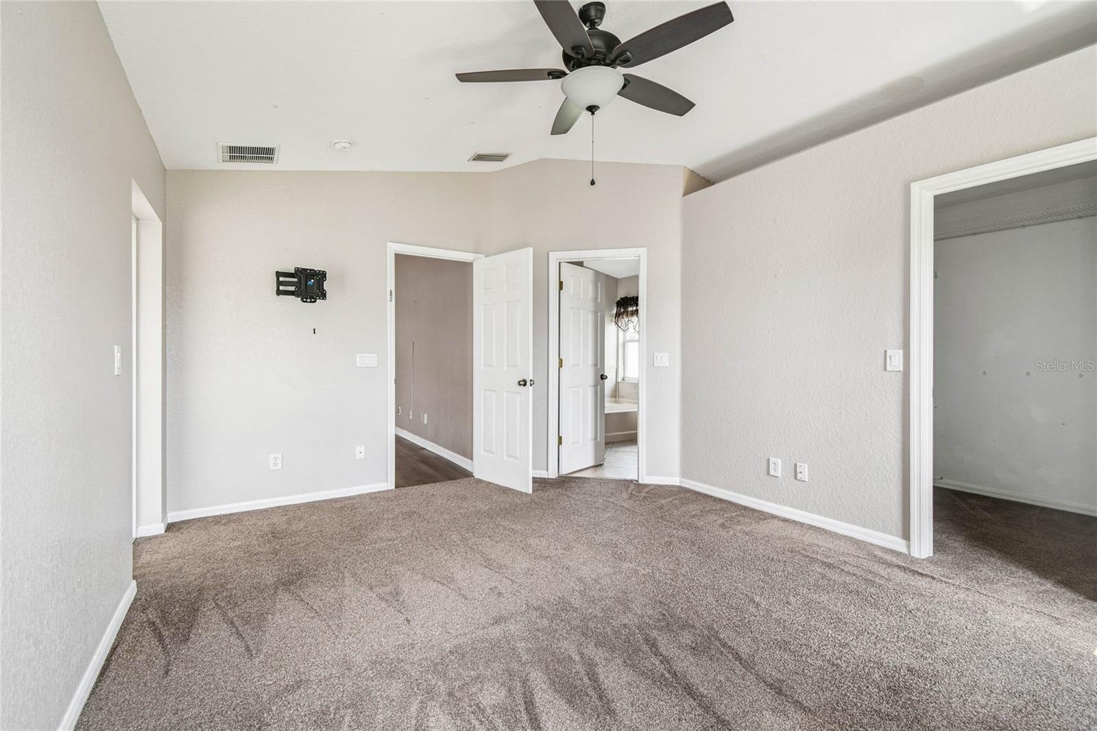 Primary bedroom has an over sized closet and en suite bathroom