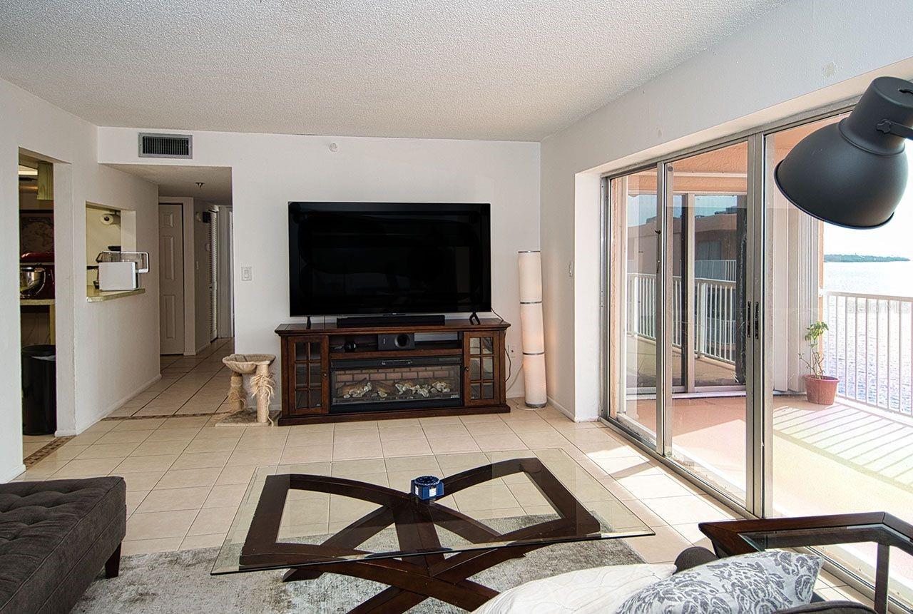 View from living area to kitchen and hallway leading to Master Suite