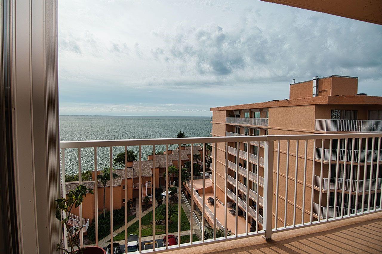 Living Room balcony, as you will notice, has protective storm shutters as well to keep the unit safe.