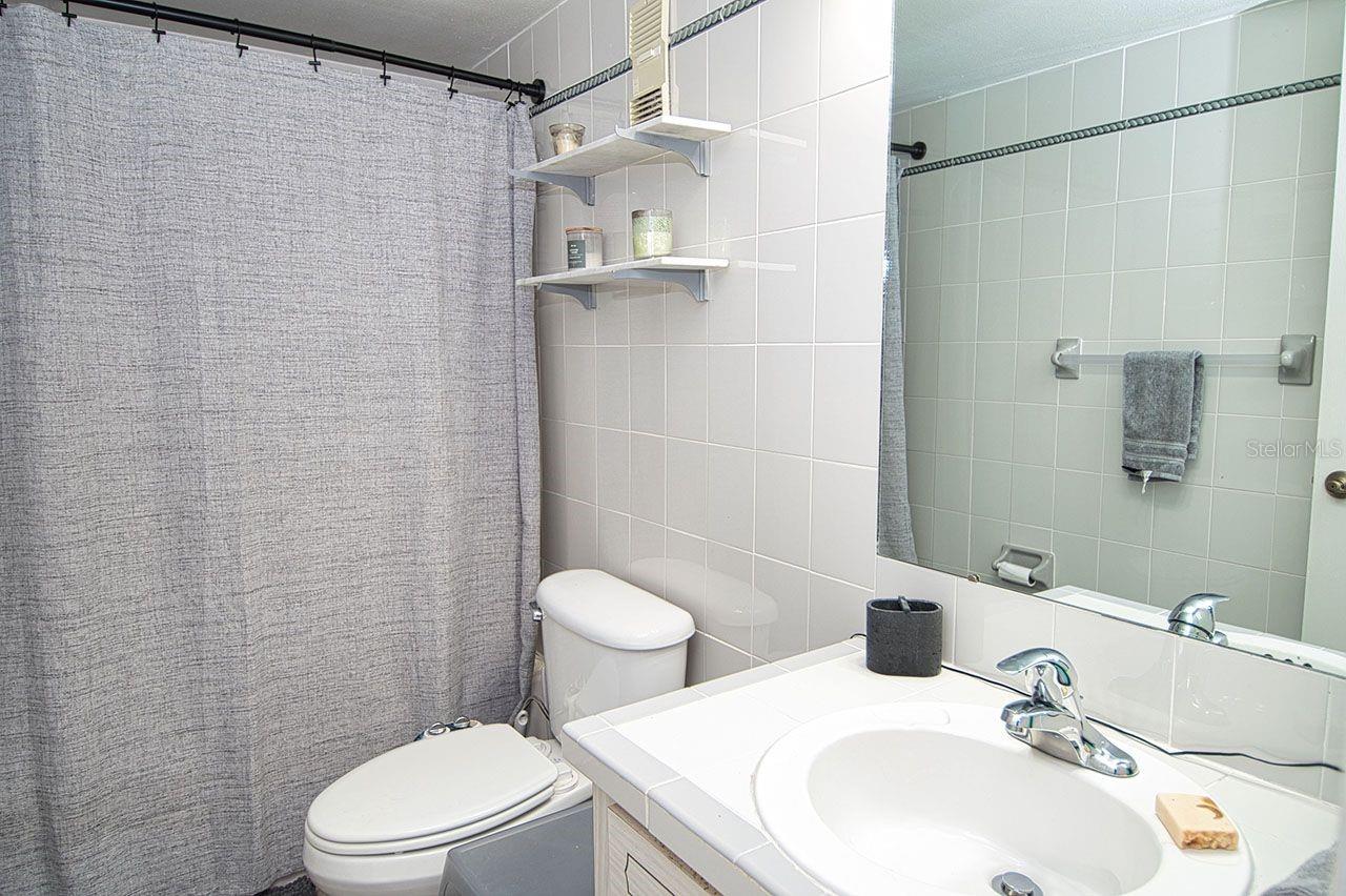 Guest Bath opposite of laundry closet outside Guest Bedroom