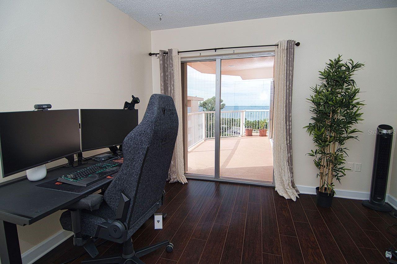 Work from home?  How perfect is this guest bedroom that doubles as an office. Sliders open to balcony with a never ending view.