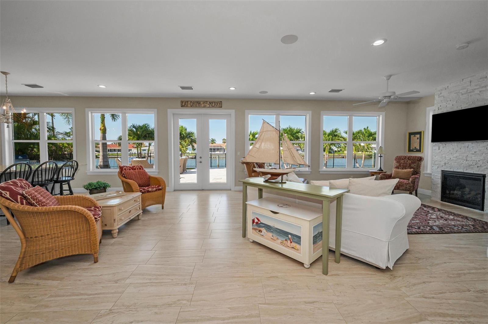 French doors leading to resort-like backyard