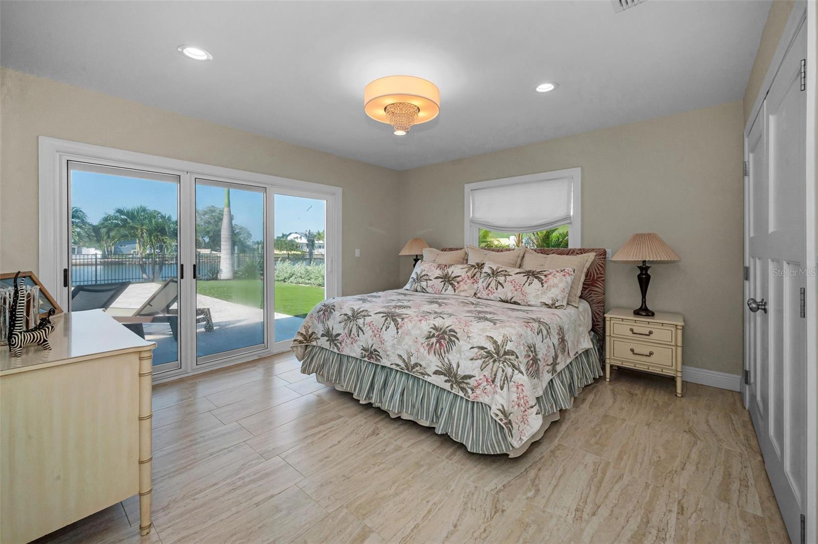 Primary Bedroom has access to backyard.