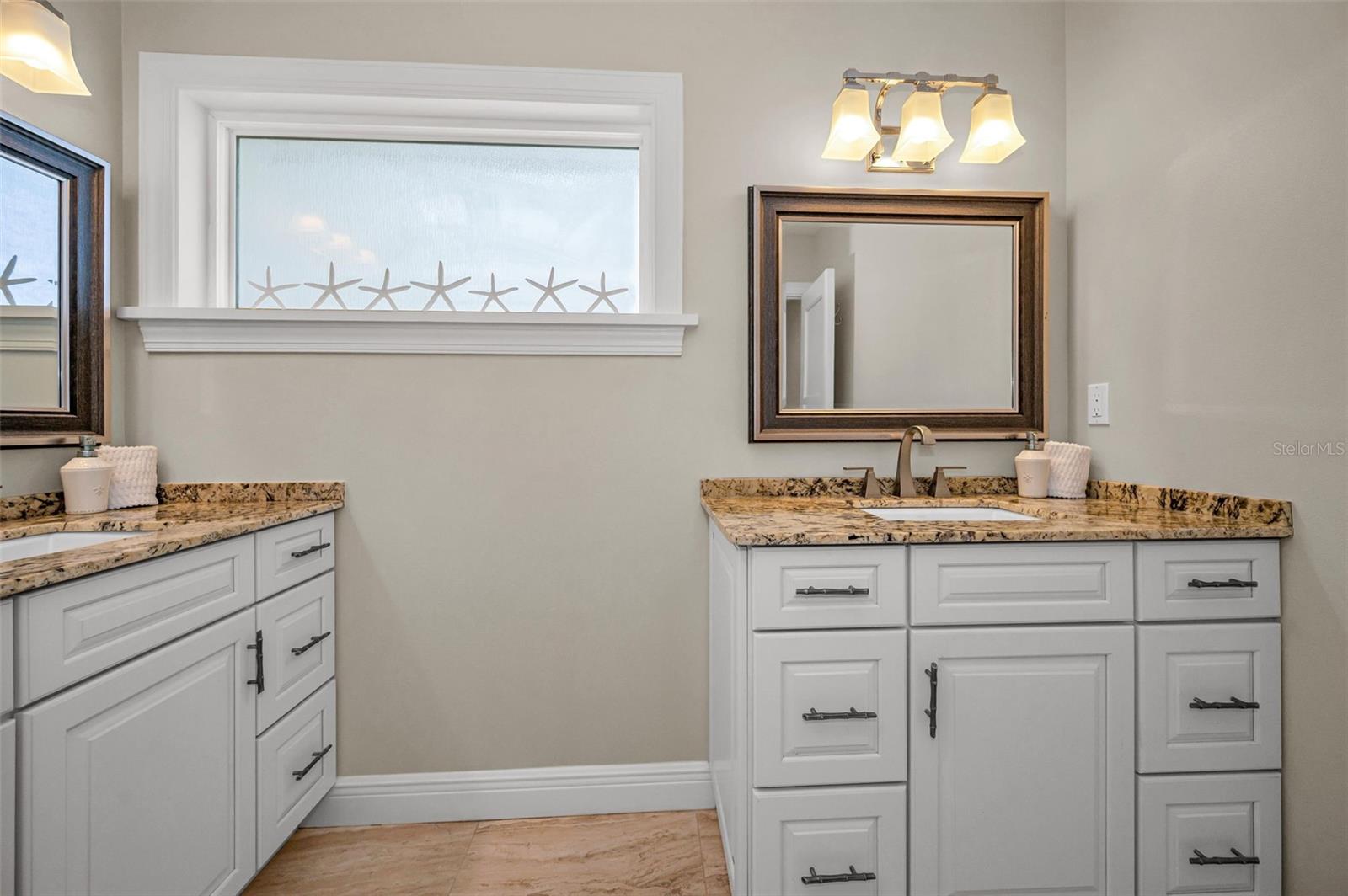 Primary En Suite Bathroom with double vanities.
