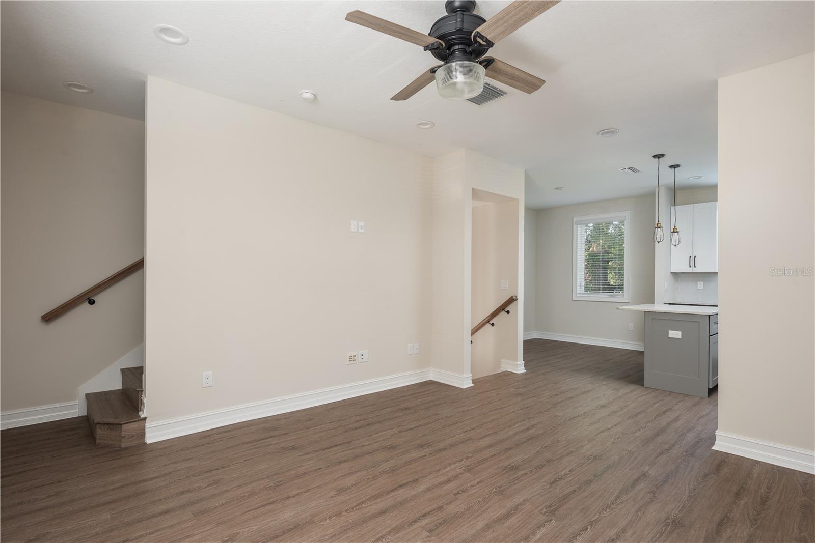 Living area to both stairs up and down