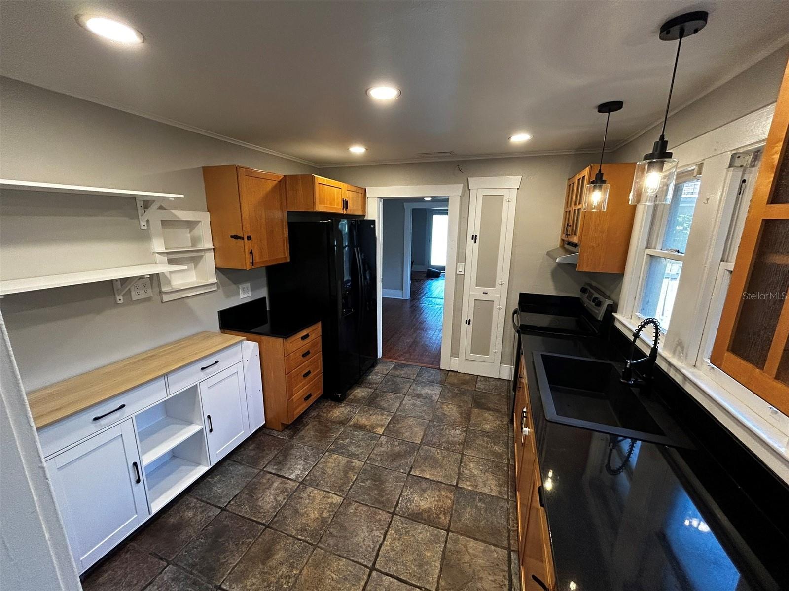 Kitchen island is on wheels for easy cooking convinience