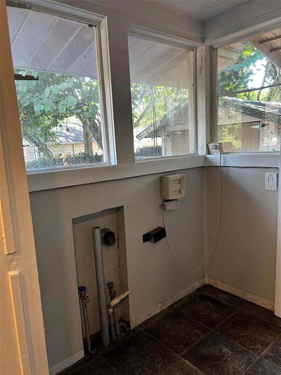 Laundry room - connected to the kitchen and leads to backyard