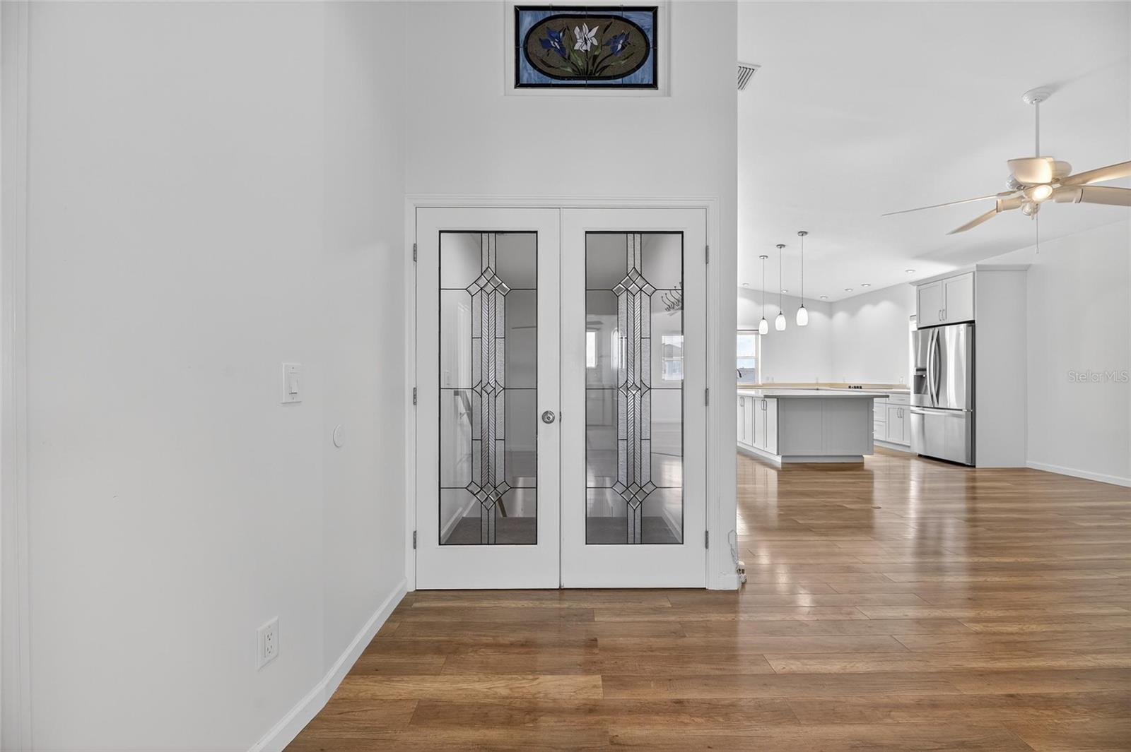 Gorgeous lead crystal doors welcome you upstairs.