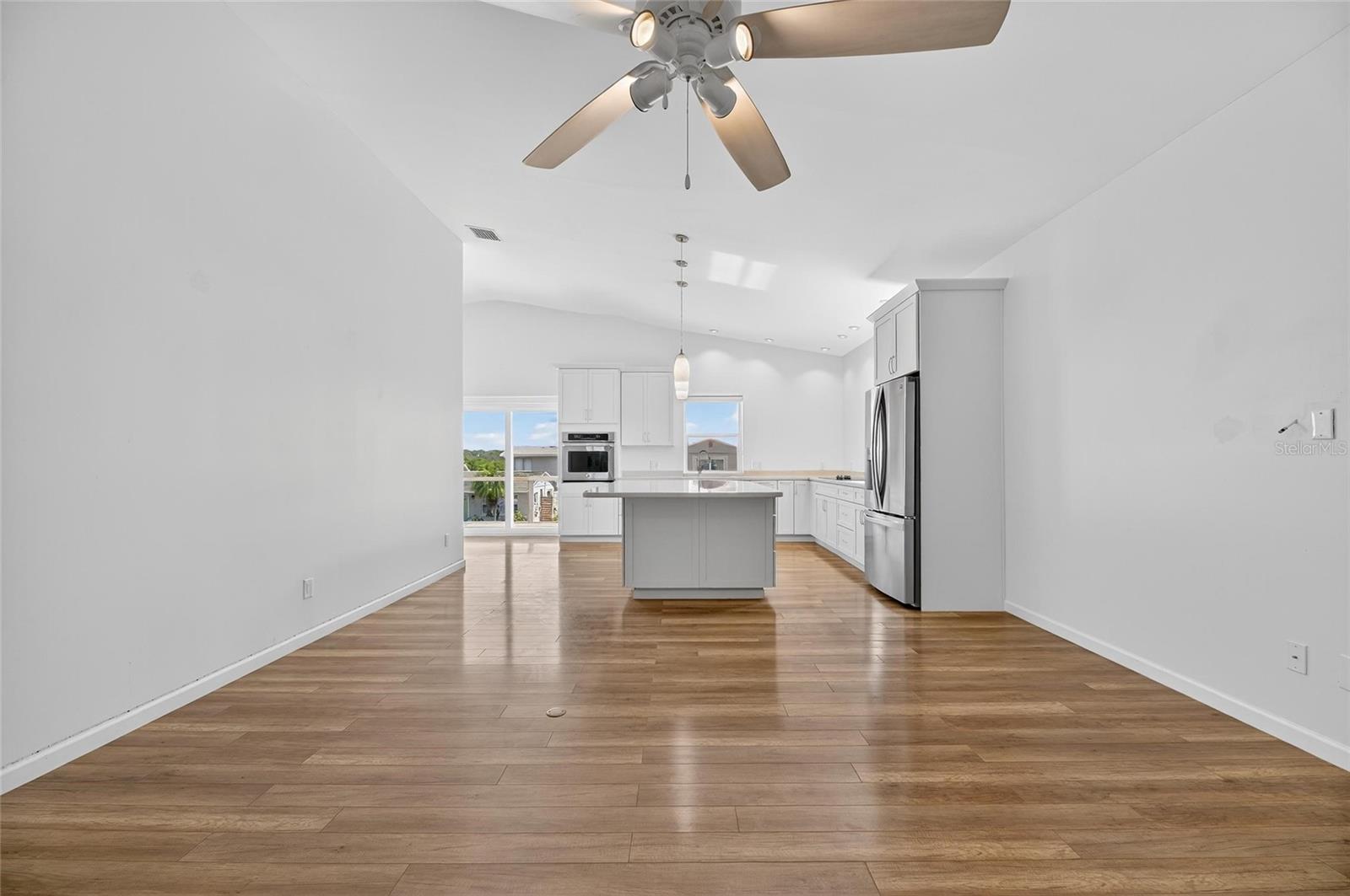 Bright and spacious living area next to the kitchen, a perfect place to entertain!