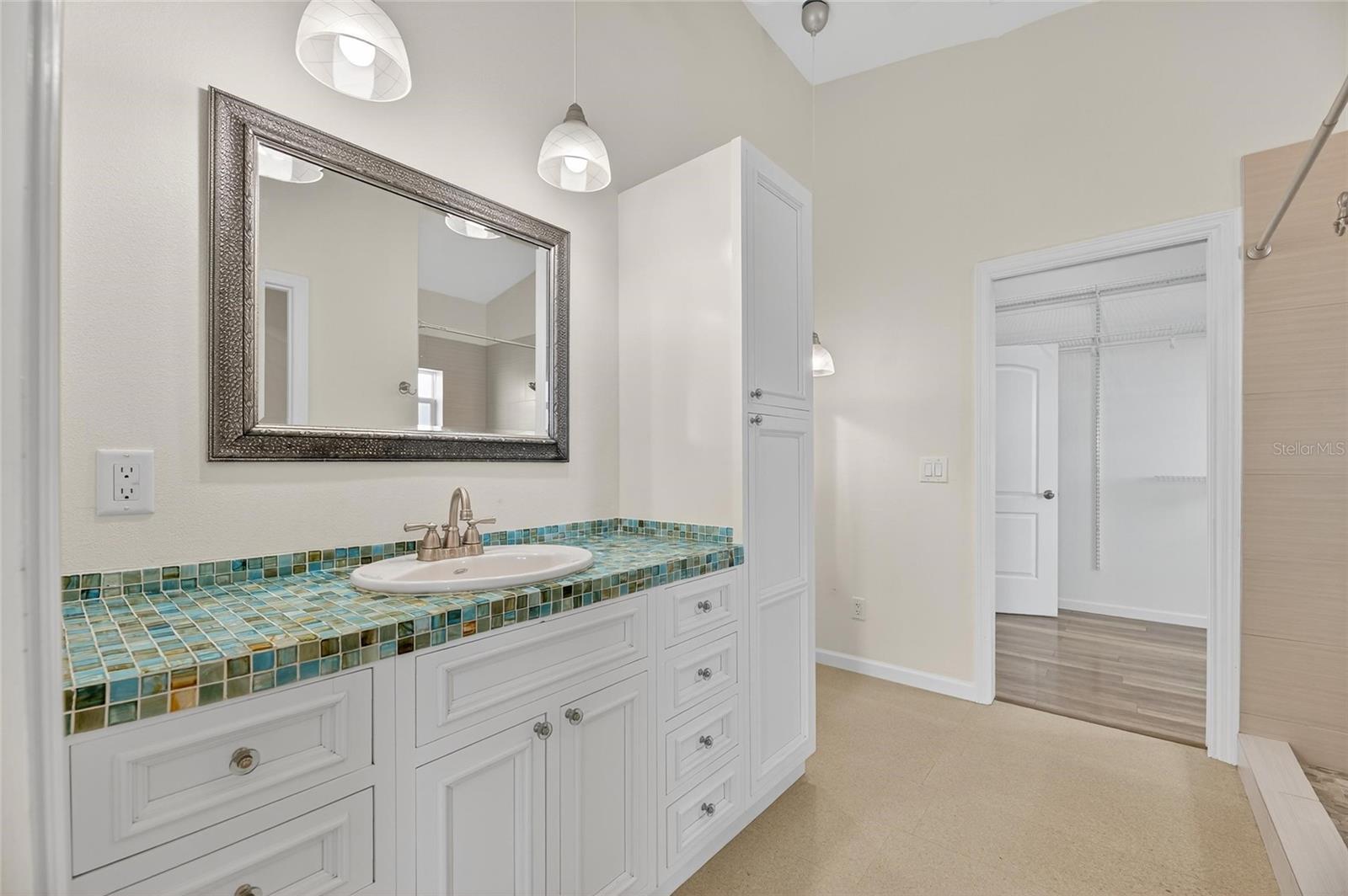Ensuite bathroom has that beachy vibe but doesn't relax on luxury