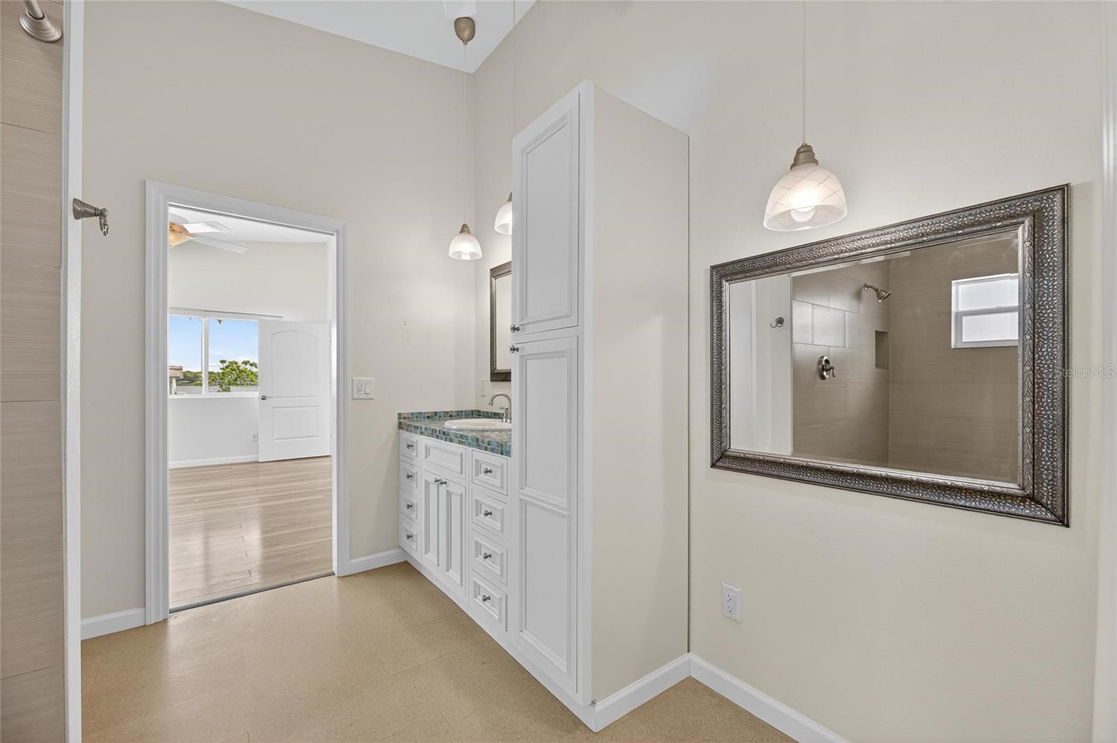 Plenty of room for a vanity set next to the linen closet