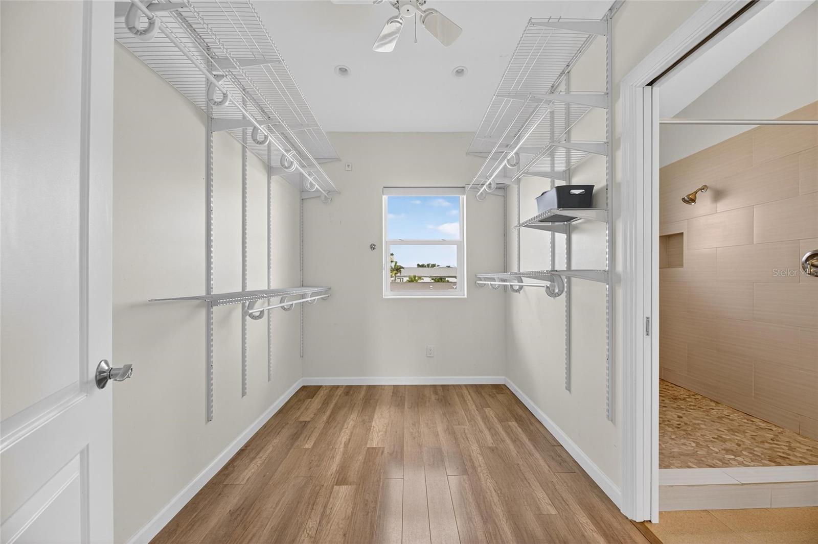 This huge walk-in closet is a dream. Plenty of room for your treasured wardrobe!