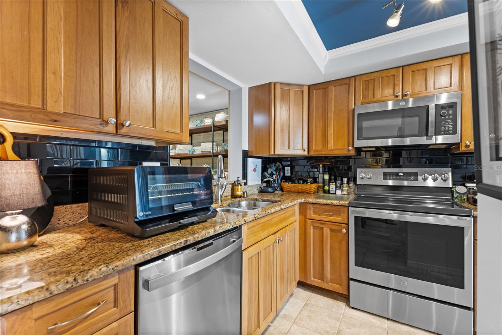 Adorned with stainless appliances.