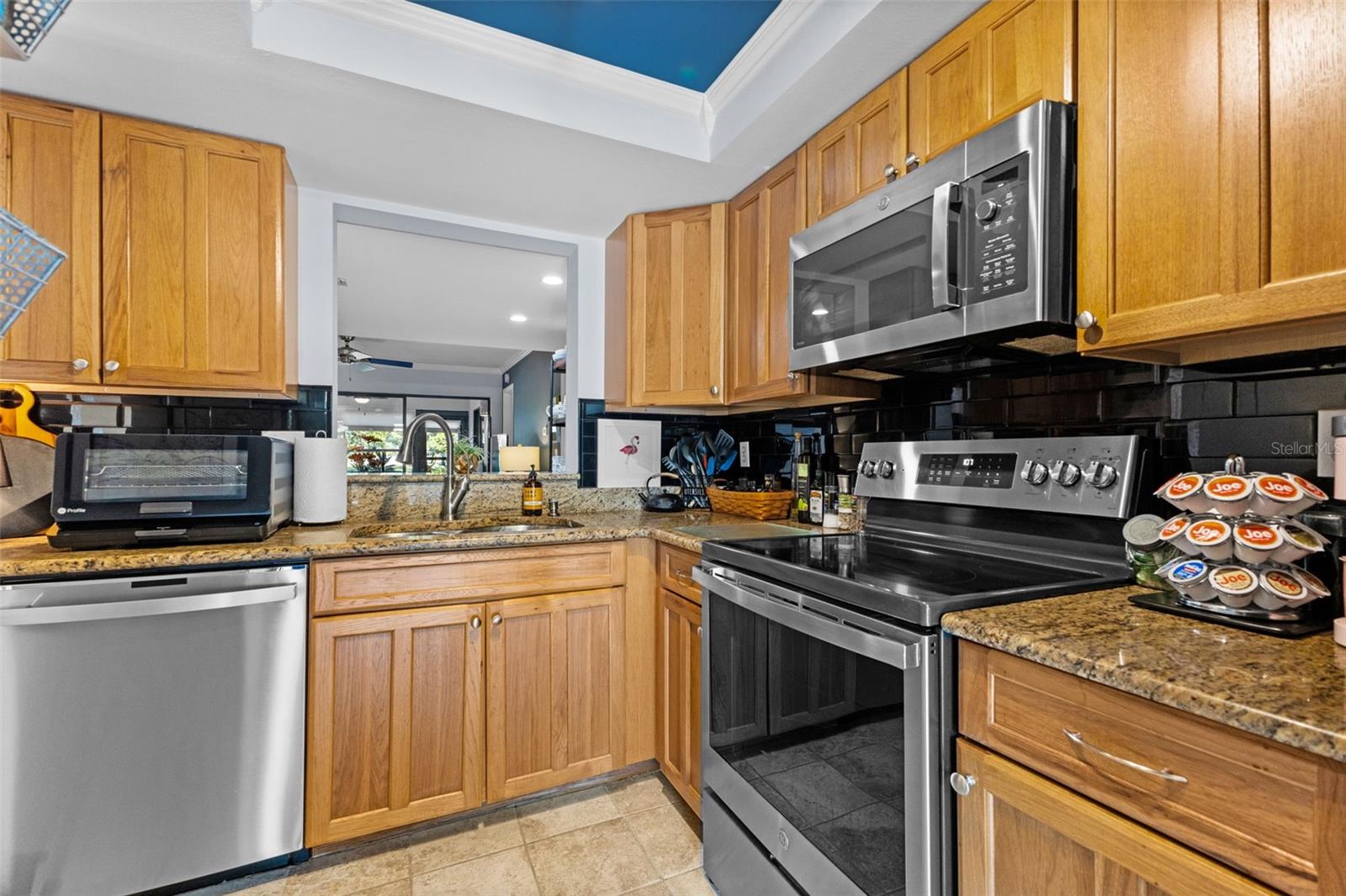 Kitchen with Pass Through Window into Living / Dining Room Combination