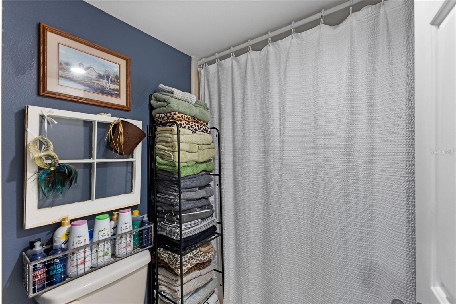 Primary Bathroom Shower Area that is private with a sliding pocket door.