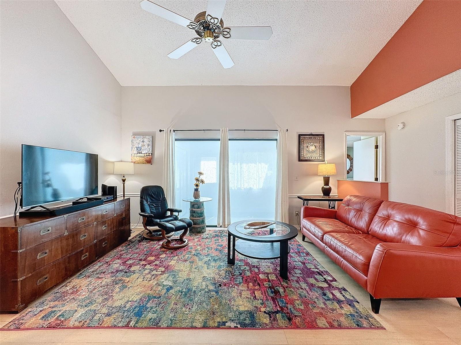 Living room and hallway to owner's retreat
