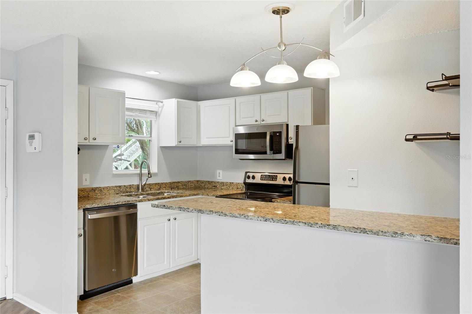 Side view of the kitchen with plenty of storage space