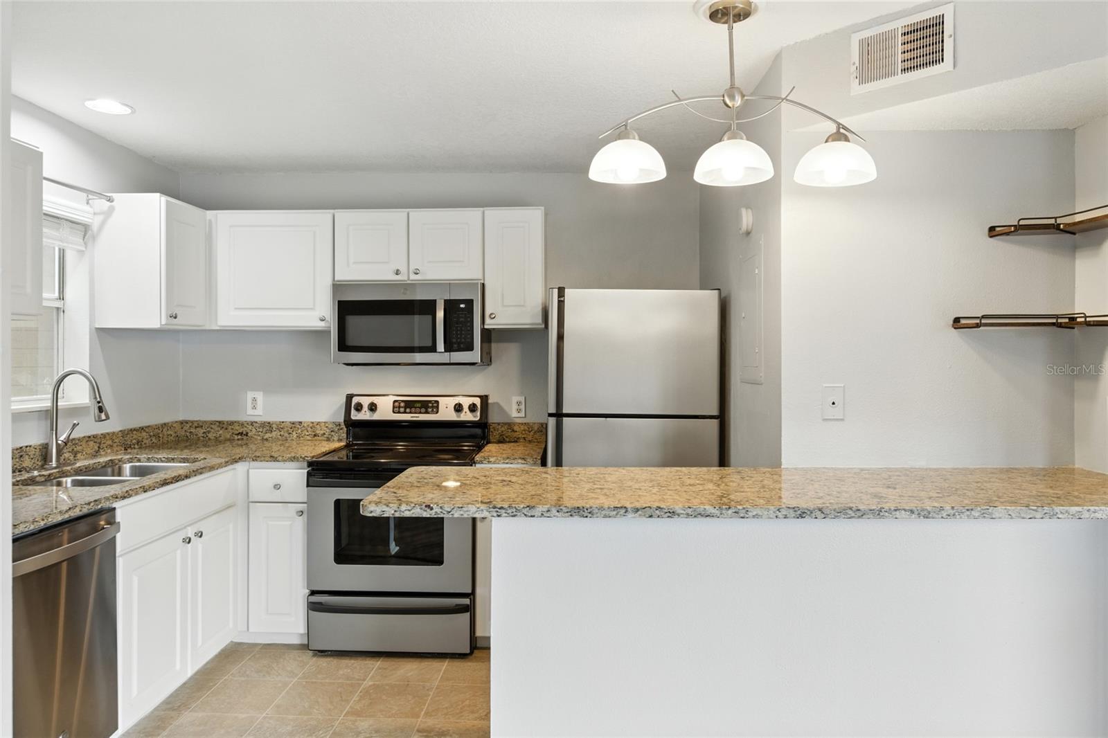 Kitchen designed for both everyday function and entertaining in a cozy use of space!