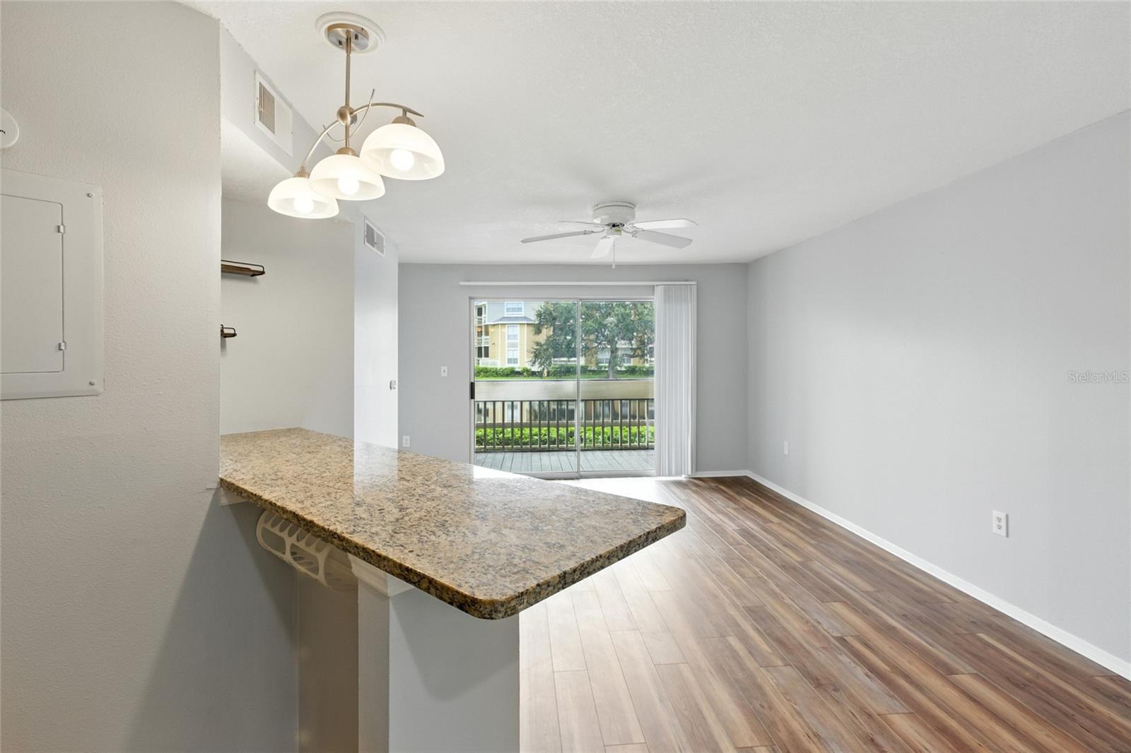 Seamless flow from kitchen to living room with access to the outdoors