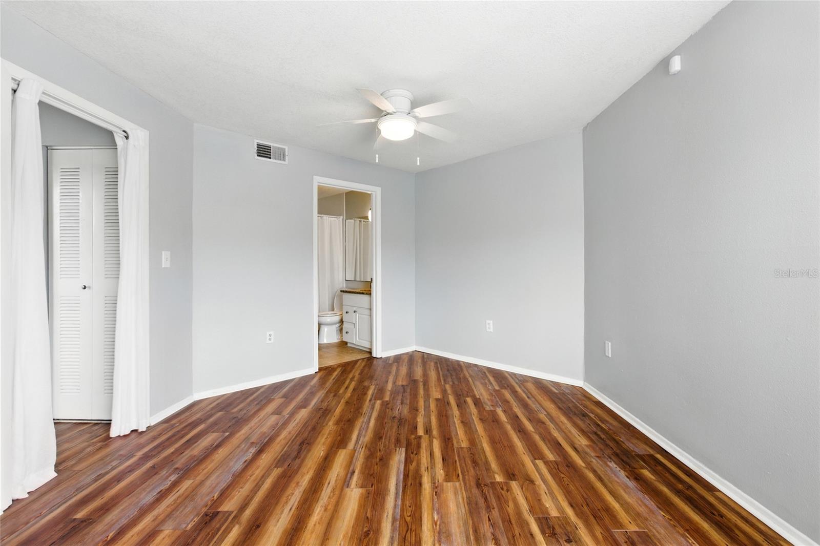 Bedroom with en-suite bath, walk-in closet, and beautiful floors!