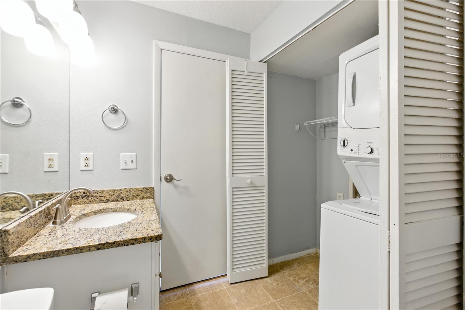 In-unit laundry with a full-size stackable washer and dryer that does convey! There is room for side by side-by-sides if that is the new owner's preference!