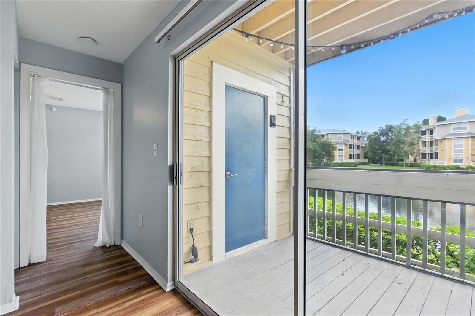 Porch access just off the living room, giving a private feel with storage and outdoor space