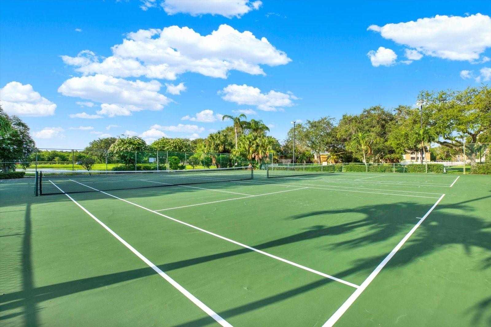Not one, but two full-size tennis courts — rare to find, even rarer to keep in this condition.