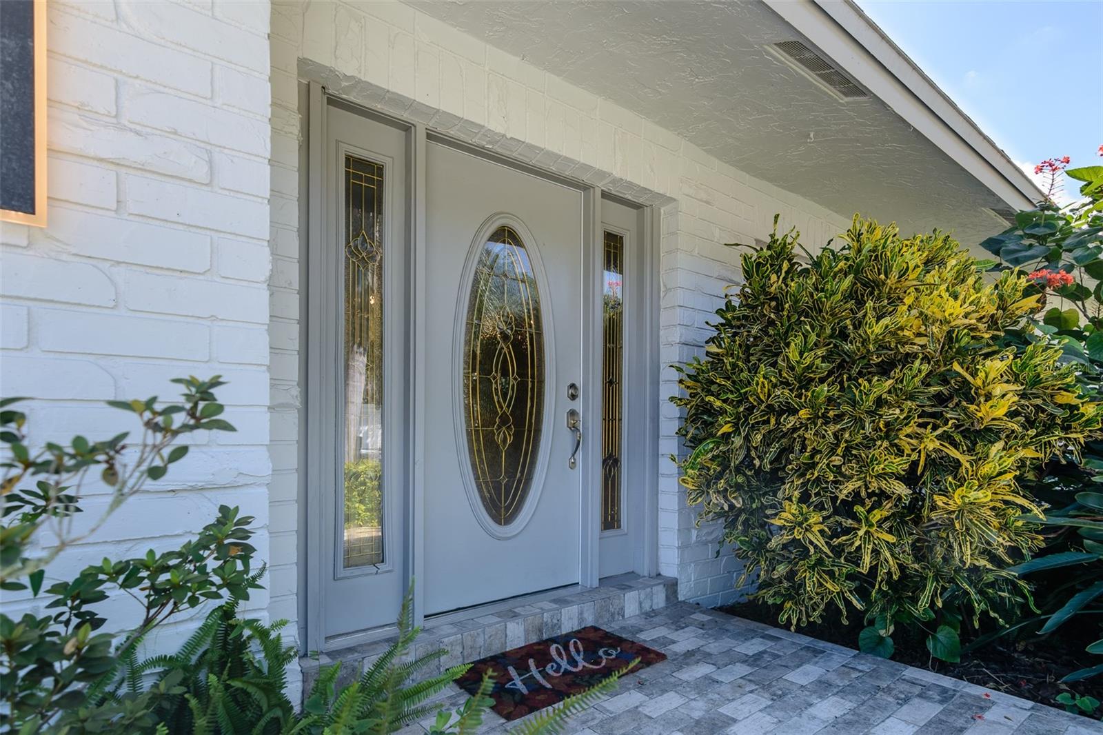 Front entrance with pavered sidewalk