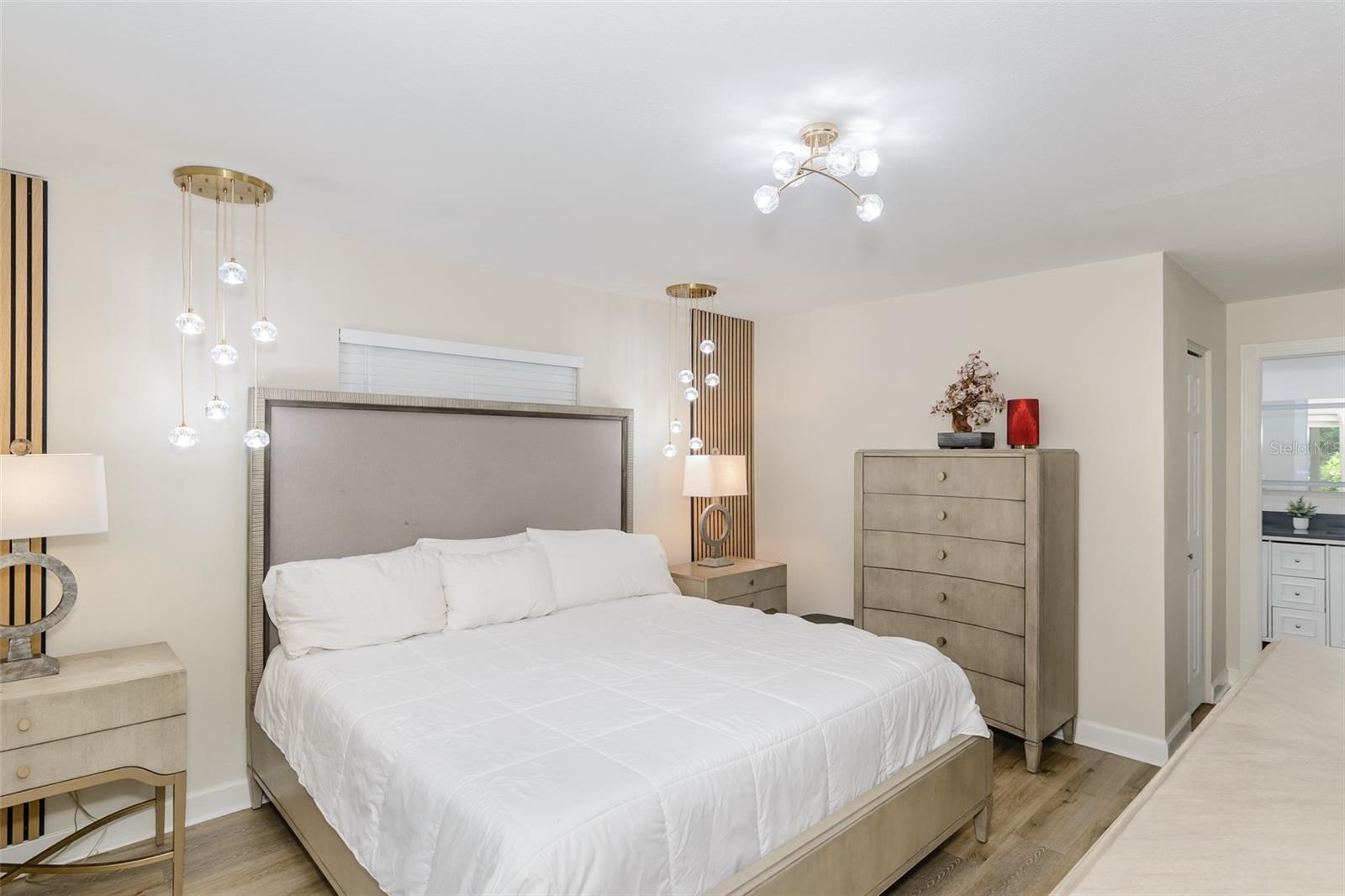 Primary bedroom with ensuite bathroom and walk-in closet.
