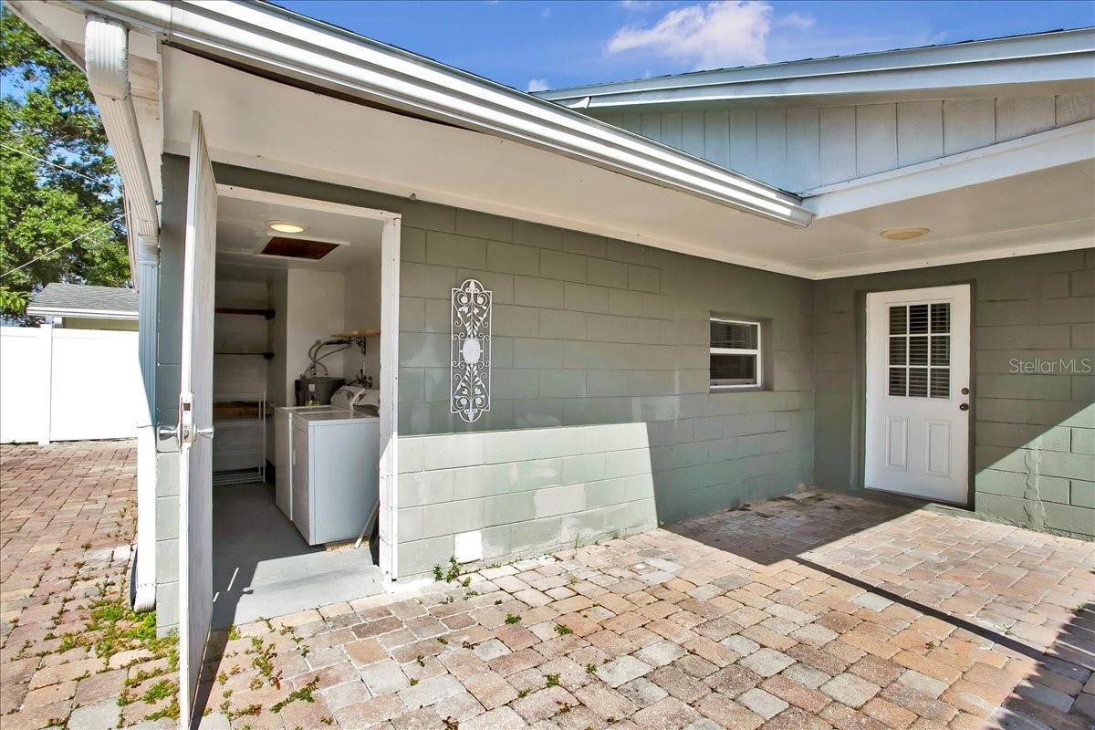 view of laundry room entrance and kitchen door entrance