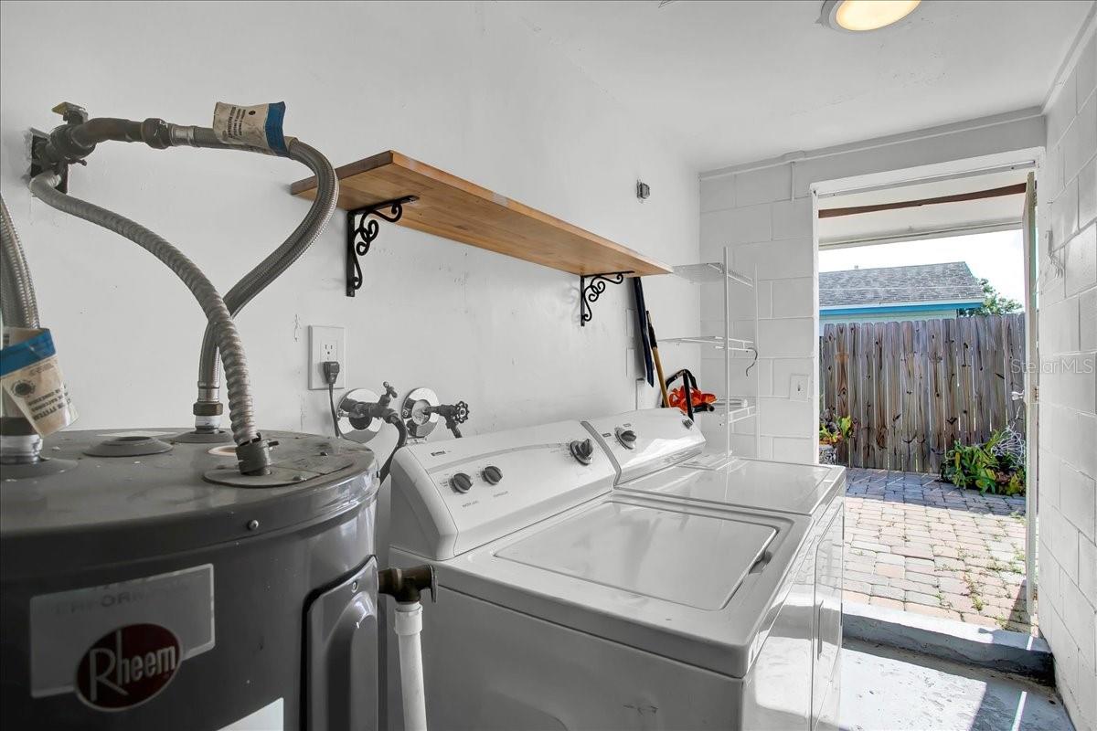 Laundry room located next to kitchen entrance