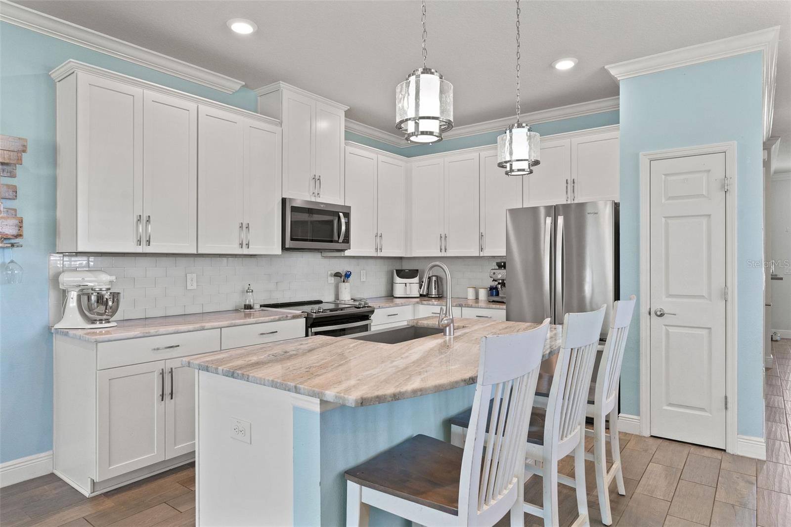 Quartz counters, high cupboards, built in pantry