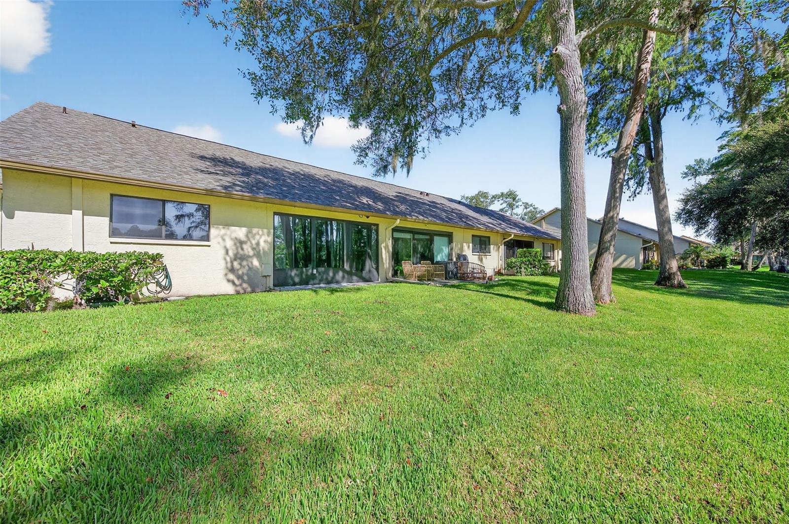 Rear of villa, Full wall of windows in Florida room