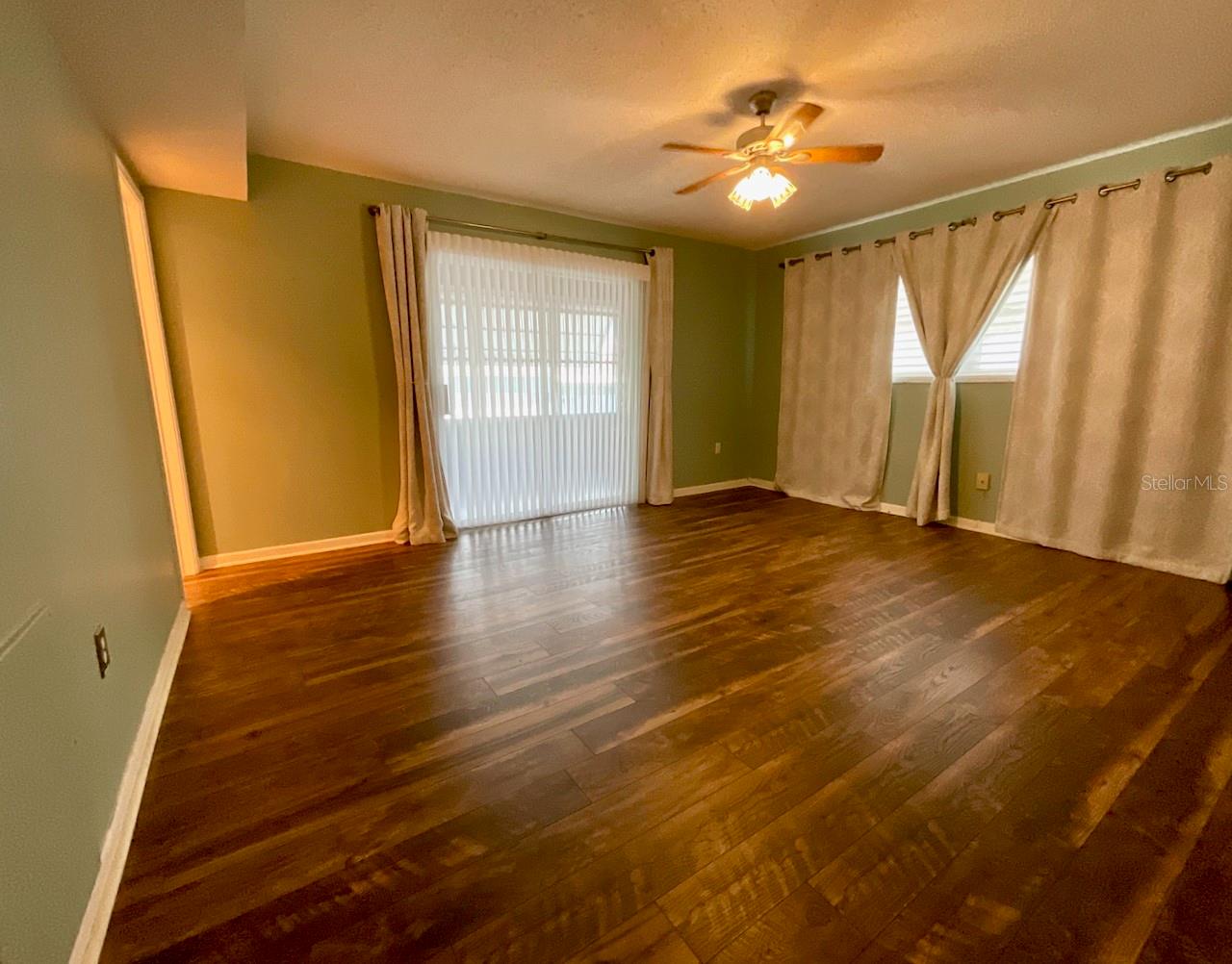 22-Primary bedroom with slider to bonus room