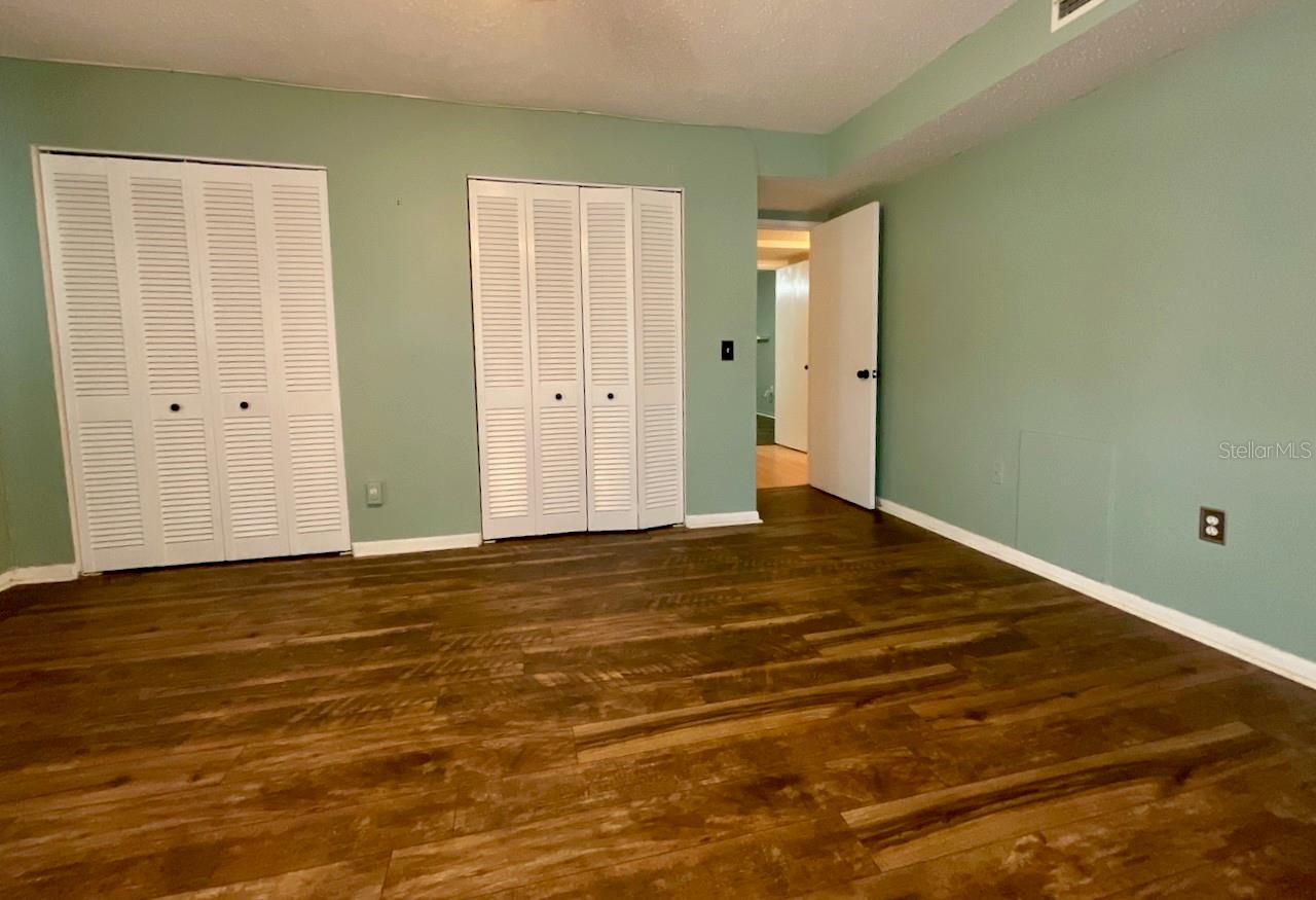 27-Primary Bedroom closets and door to hallway