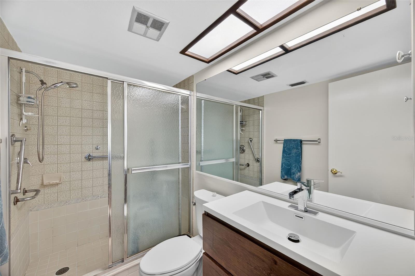 Primary en-suite bathroom with walk in shower