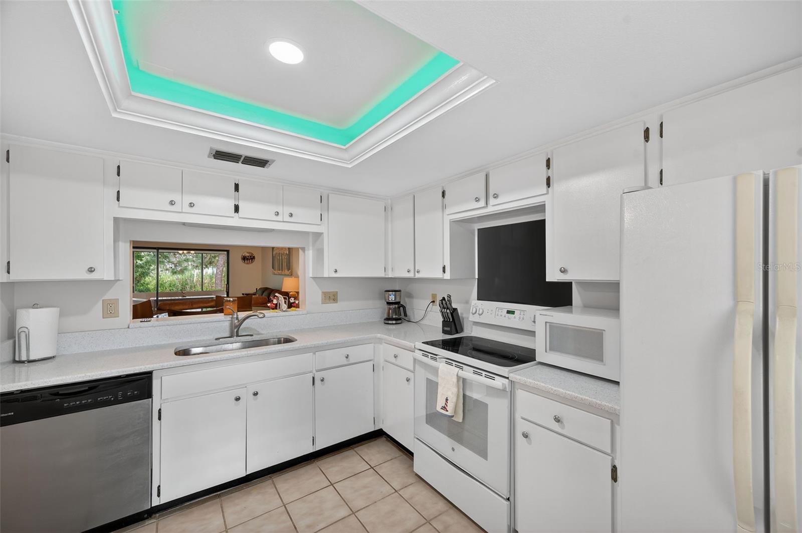 Kitchen overlooks dining & living room