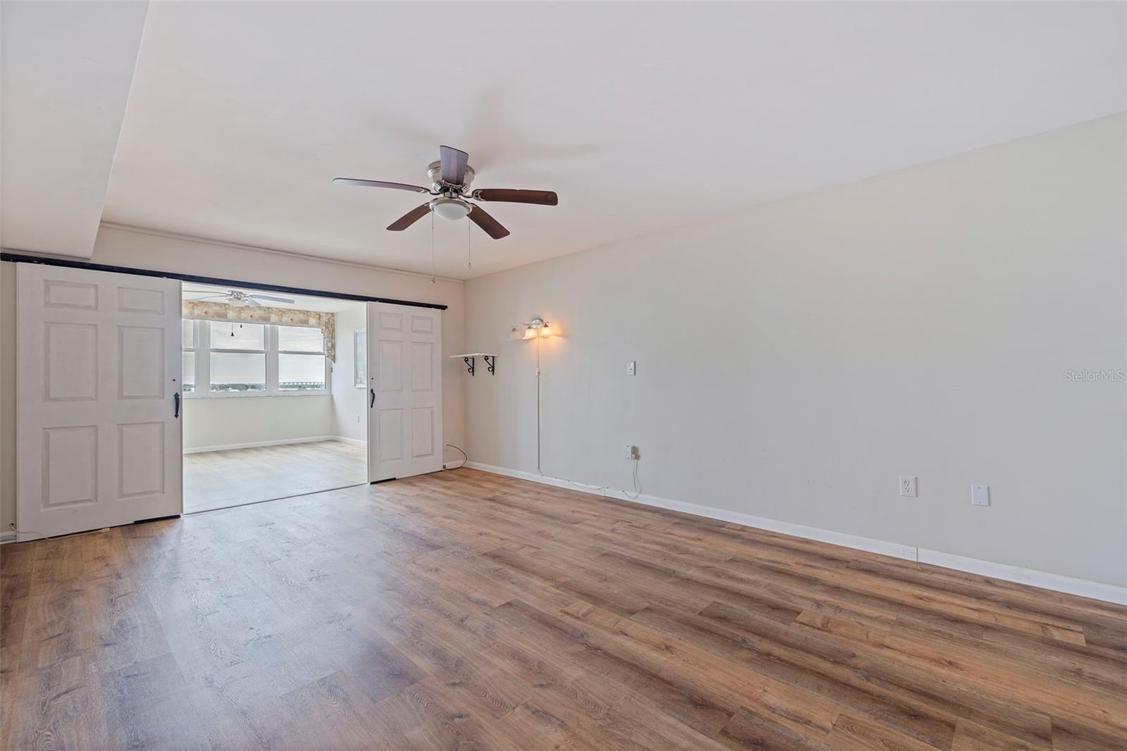 Primary bedroom with barn doors