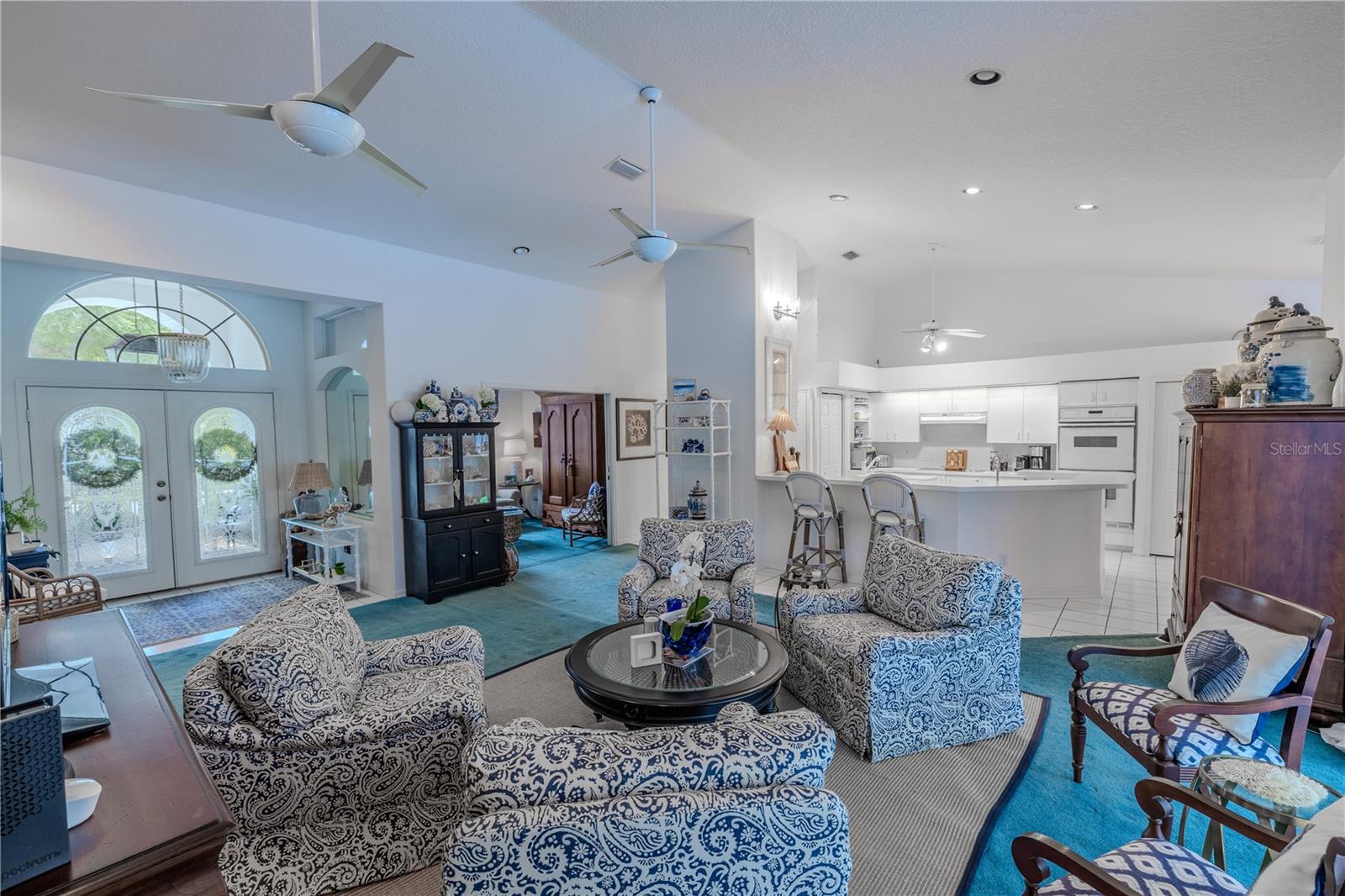 This open-concept design connects the living room, kitchen, and foyer, creating a bright and airy space that’s perfect for entertaining or everyday living.