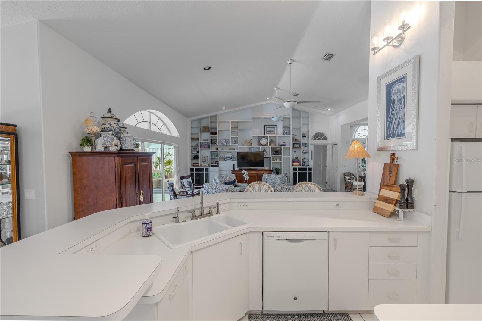 The kitchen sink and bar area overlook the living room, keeping you connected while cooking or entertaining.