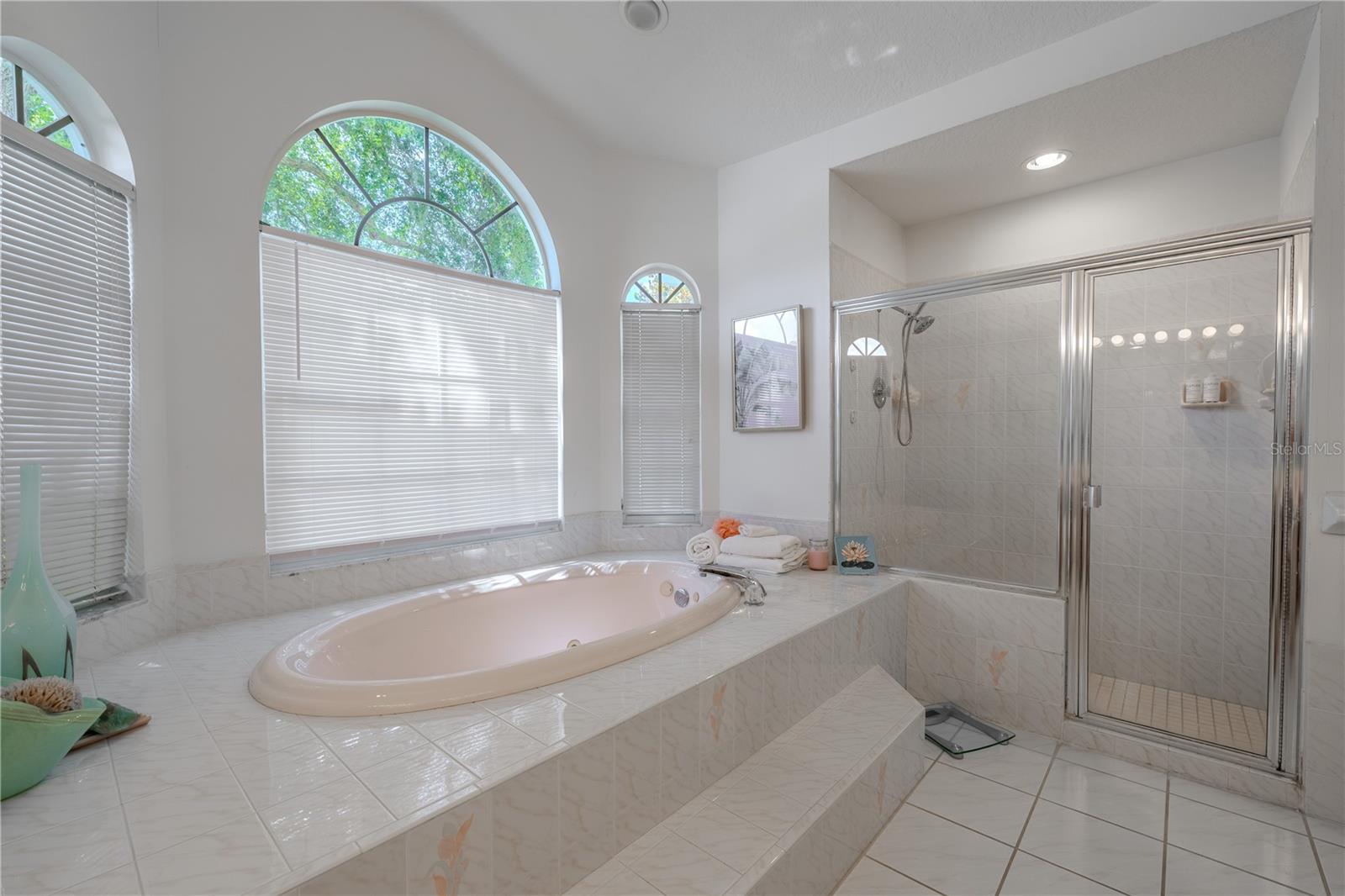 The raised tile platform adds a touch of luxury while providing a practical step-up design.