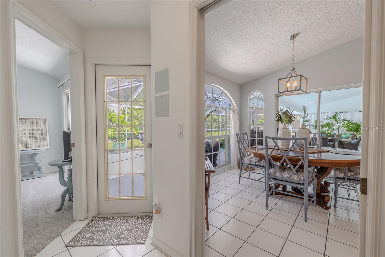 Just off the kitchen/dining area, a hallway leads to the home’s additional bedrooms and second full bath, providing privacy for family or guests.