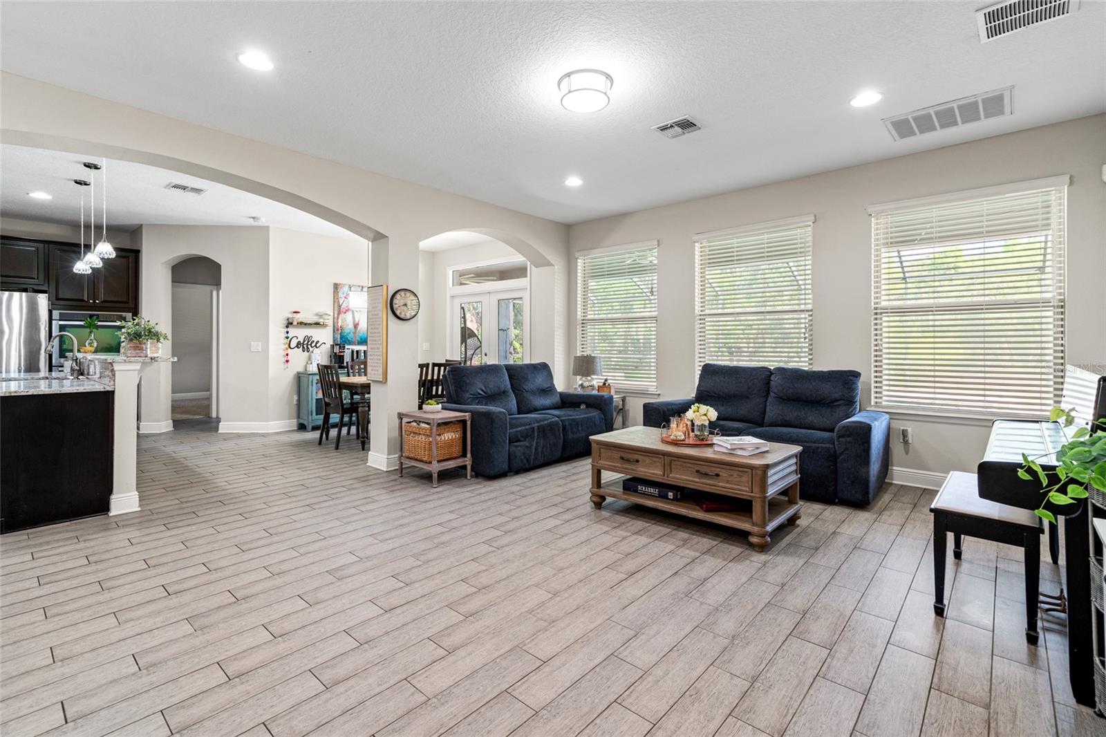 Living Room, Kitchen, Breakfast Room Overlooking Pool